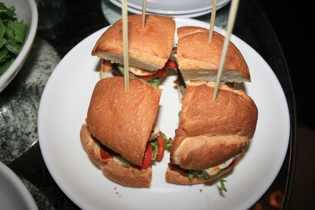 Vegetarian haloumi cheese burger with roasted capsicum, sundried tomato, cucumber, lettuce & basil pesto mayo